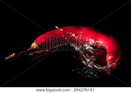Red Pepper Vegetables Making Splash In Water