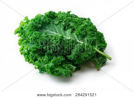 Kale. King of nutrition. A Kale leaf isolated on white.