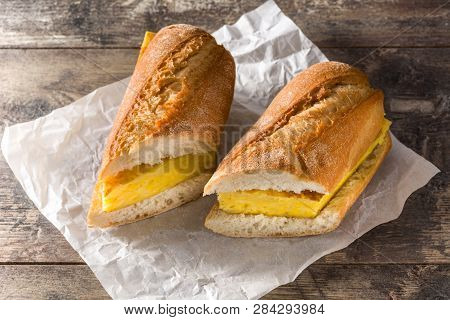 Bocadillo De Tortilla Española. Spanish Potato Omelette Sandwich On Wooden Table.