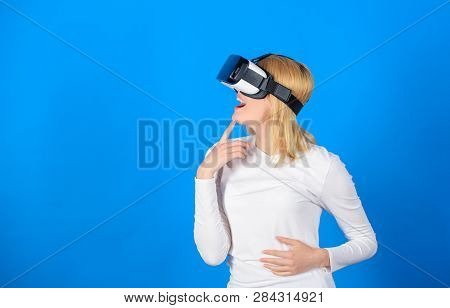 Woman With Virtual Reality Headset. Happy Young Woman Wearing Virtual Reality Goggles Watching Movie