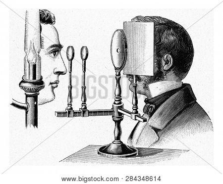 Ophthalmoscope by Helmholtz, vintage engraved illustration. From the Universe and Humanity, 1910.