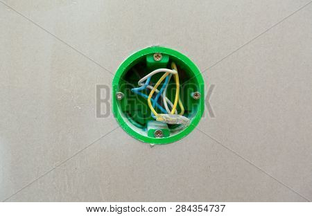 Unfinished Electrical  Mains Outlet Socket  With Electrical Wires Installed In Plasterboard Or Drywa