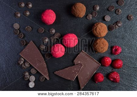 Theme Sweet Dessert Cake Handmade. Macro Close-up Dessert Sweet Candy Round Ball Truffle Set Of Blac