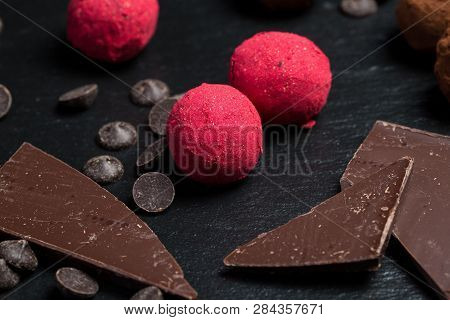 Theme Sweet Dessert Cake Handmade. Macro Close-up Dessert Sweet Candy Round Ball Truffle Set Of Blac