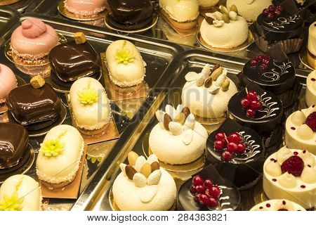 Multi-colored, Different And Tasty Cakes On A Show-window In Cafe. For Every Taste. Big Assortimt Sw