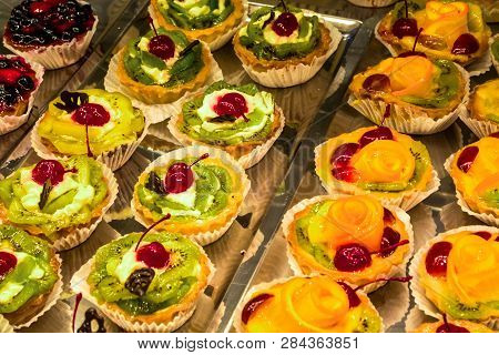 Multi-colored, Different And Tasty Cakes On A Show-window In Cafe. For Every Taste. Big Assortimt Sw