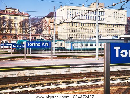Turin, Italy - January 1, 2019. A Train Crossing The Railway Catenaries Of Turin Porta Nova Train St