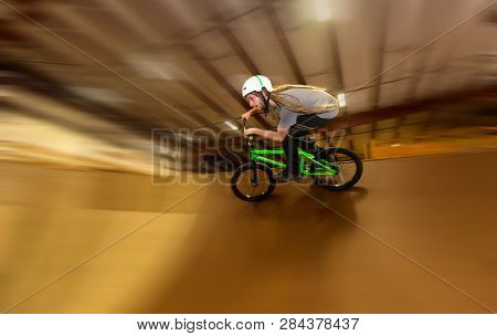 Man Jumping And Riding On A Bmx Bicycle At An Extreme Sports Park
