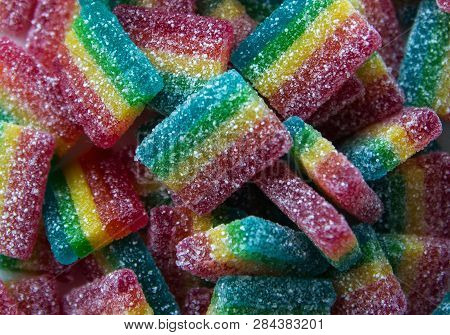 Many Sweet Multicolor Fruit Jelly Covers A Surface