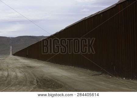 Wall  Seperating The United States From Mexico At Jacumba In California