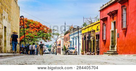 Oaxaca, Mexico On 24th April 2016: View On Street With Colorful Colonial Buildings In Th Eold Town W
