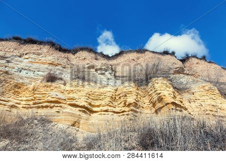 Rockslide. Mountain Landslide In An Environmentally Hazardous Area. Large Cracks In Earth, Descent O