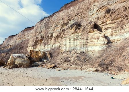 Rockslide. Mountain Landslide In An Environmentally Hazardous Area. Large Cracks In Earth, Descent O