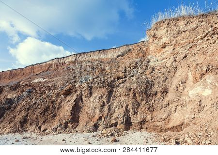 Rockslide. Mountain Landslide In An Environmentally Hazardous Area. Large Cracks In Earth, Descent O