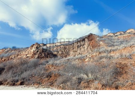 Rockslide. Mountain Landslide In An Environmentally Hazardous Area. Large Cracks In Earth, Descent O
