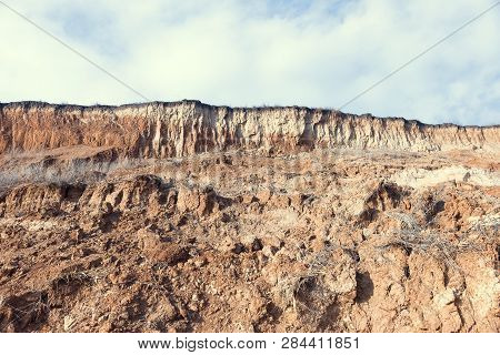 Rockslide. Mountain Landslide In An Environmentally Hazardous Area. Large Cracks In Earth, Descent O
