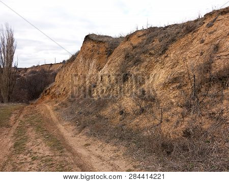 Rockslide. Mountain Landslide In An Environmentally Hazardous Area. Large Cracks In Earth, Descent O