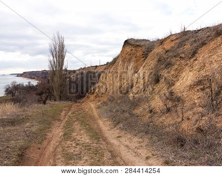 Rockslide. Mountain Landslide In An Environmentally Hazardous Area. Large Cracks In Earth, Descent O