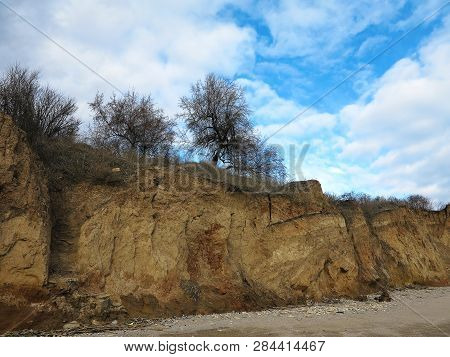 Rockslide. Mountain Landslide In An Environmentally Hazardous Area. Large Cracks In Earth, Descent O