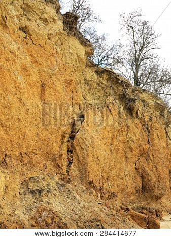 Rockslide. Mountain Landslide In An Environmentally Hazardous Area. Large Cracks In Earth, Descent O