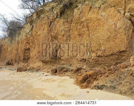Rockslide. Mountain Landslide In An Environmentally Hazardous Area. Large Cracks In Earth, Descent O