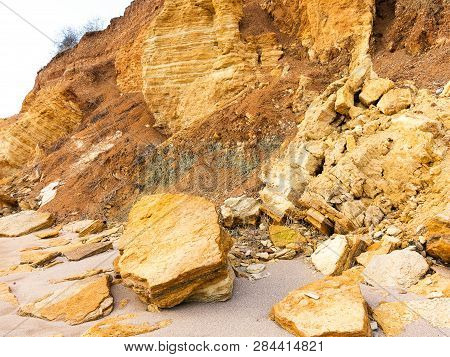 Rockslide. Mountain Landslide In An Environmentally Hazardous Area. Large Cracks In Earth, Descent O