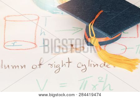 Graduation Cap On Paper Math Formula Equation Graph And Blur Of America Earth World Globe Model Map 