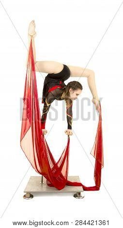 Flexible Equilibrist Performs Exercises On Acrobatic Walking Sticks.