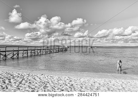 West Coast National Park, South Africa, August 20, 2018: A Person Digging For Prawns At The Jetty At