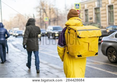 Courier Delievery Guy With Huge Backpack On Foot