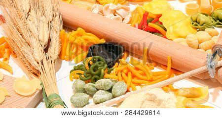 Italian Homemade Pasta With Various Formats Called Tagliatelle Tortellini And Ears Of Ripe Wheat And