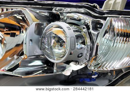 Macro View Of Repairing, Installation And Tuning Headlight Of Modern Automobile And Car Projector Le