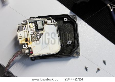 Macro View Of Repairing, Installation And Tuning Headlight Of Modern Automobile And Car Projector Le
