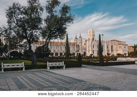 Sunset At Jeronimos Monastery In Belem, Lisbon, Portugal. Unesco World Heritage Site. Garden And Fro