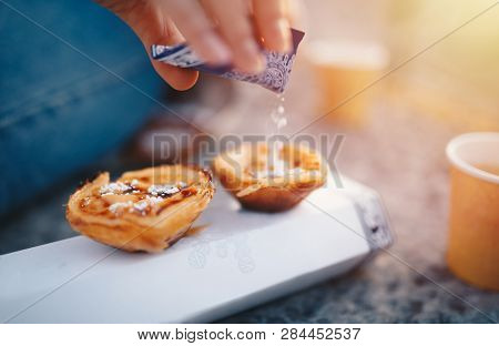 Portuguese Cake - Pasteis De Belem Or Nata. Pasteis De Belem With Sugar Powder And Cinnamon. Sunrise
