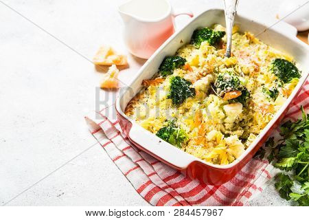 Casserole From Pasta And Vegetables - Carrot, Broccoli And Cauliflower In Cream Sauce With Parmesan.