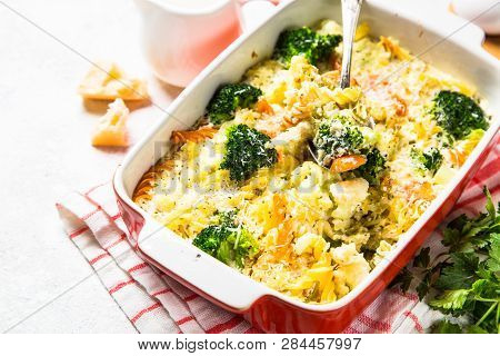 Casserole From Pasta And Vegetables - Carrot, Broccoli And Cauliflower In Cream Sauce With Parmesan.