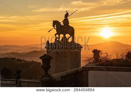 Braga, Portugal - Circa February 2019: Sunset Silhouette Of Sculpture Of St Longinus In Famous Sanct