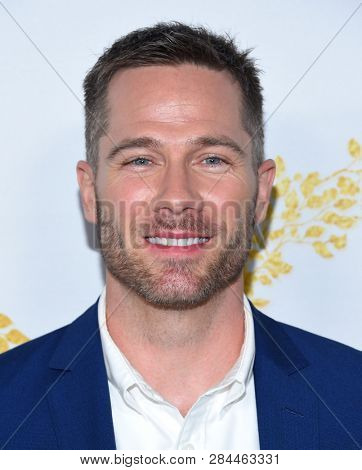 LOS ANGELES - FEB 09:  Luke Macfarlane arrives for the {Event} on February 09, 2019 in Pasadena, CA                