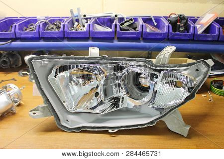 Macro View Of Repairing, Installation And Tuning Headlight Of Modern Automobile And Car Projector Le