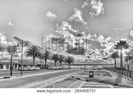 Langebaan, South Africa, August 20, 2018: A Late Afternoon Street Scene, With Businesses And Vehicle