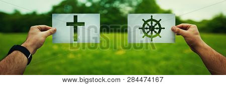 Religion Conflicts As Global Issue Concept. Two Hands Holding Different Faith Symbols, Buddhism Vs C