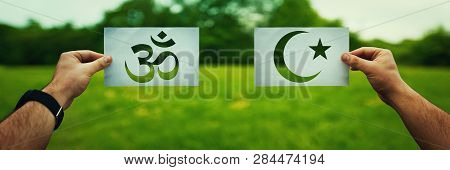 Religion Conflicts As Global Issue Concept. Two Hands Holding Different Faith Symbols, Islam Vs Hind