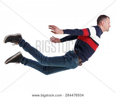 Side view of man in zero gravity or a fall. guy is flying, falling or floating in the air.   side view of person.  Isolated over white background. The guy in the jacket hangs in zero gravity