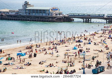 BOURNEMOUTH, UK - 1st JUNE, 2017: Bournemouth beach pier and coast, Dorset