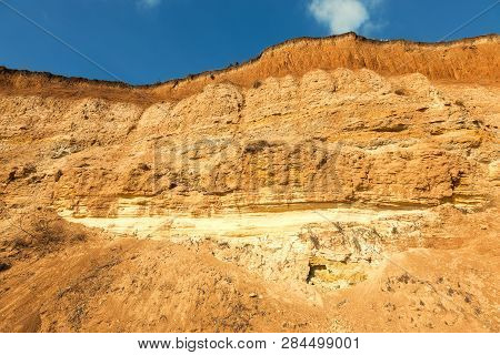 Rockslide. Mountain Landslide In An Environmentally Hazardous Area. Large Cracks In Earth, Descent O