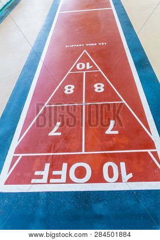 Scoring Markers On The Shuffleboard Court Of A Modern Cruise Ship