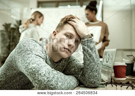 Handsome Postgraduate Student Feeling Unmotivated While Studying