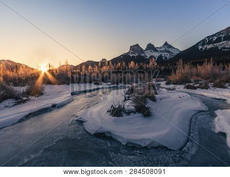 The Three Sisters Are A Trio Of Peaks Near Canmore, Alberta, Canada. They Are Known Individually As 