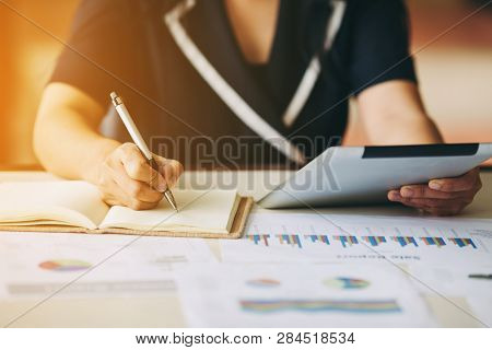 Business Woman Investment Consultant Analyzing Company Annual Financial Report Balance Sheet Stateme
